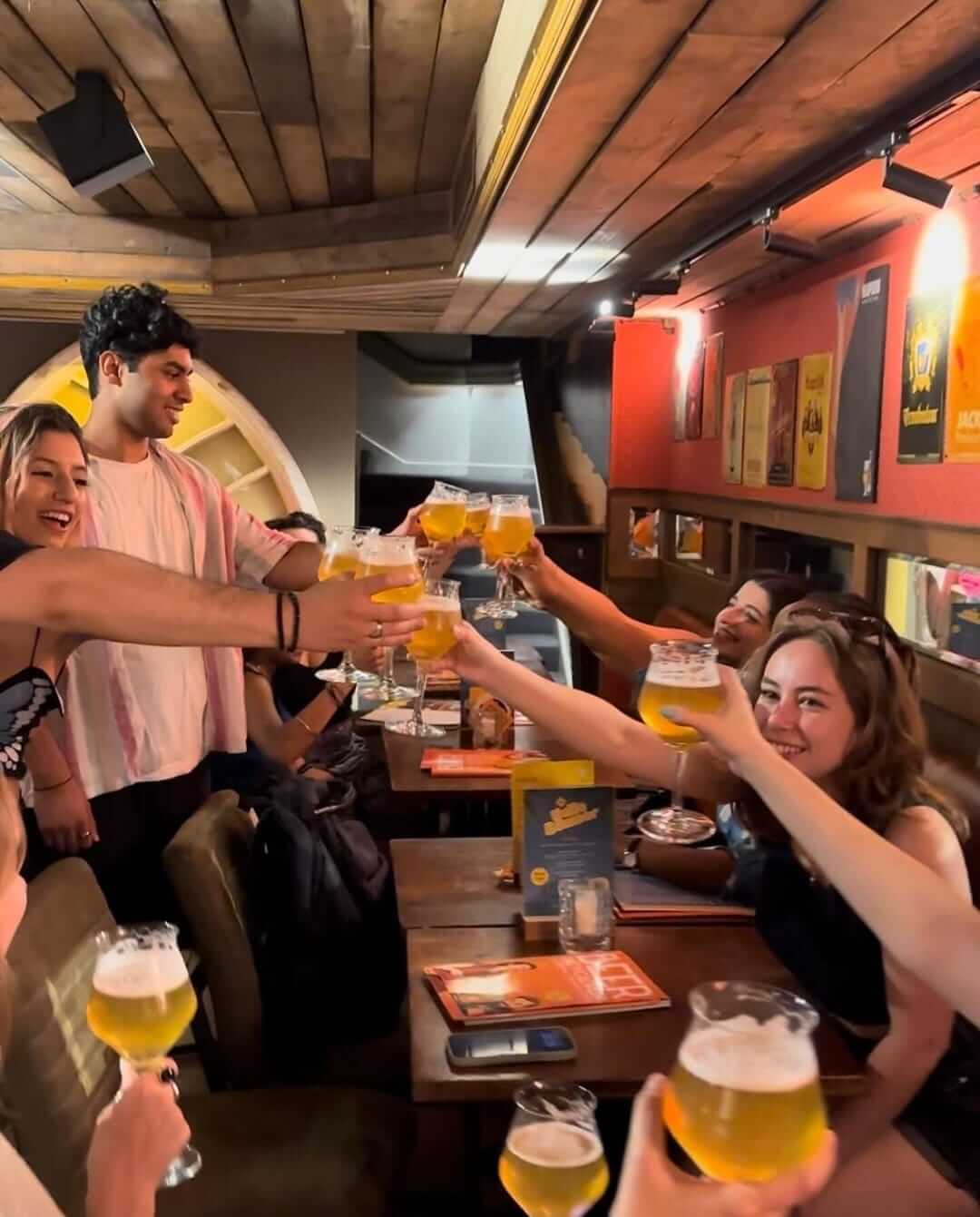 group of people cheering in brussels during tipsy tour