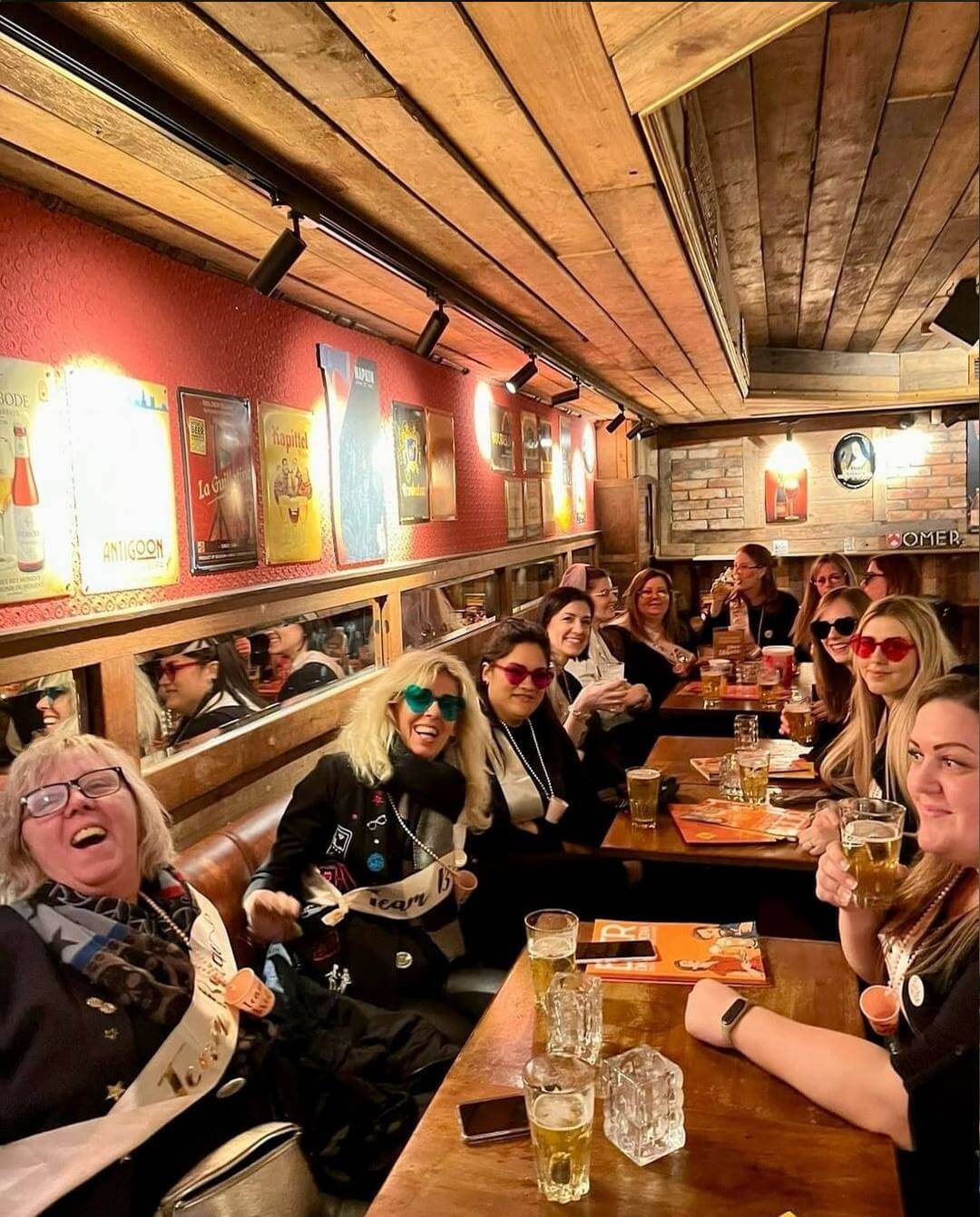 group of people cheering and drinking in brussels beer & chocolate pairing